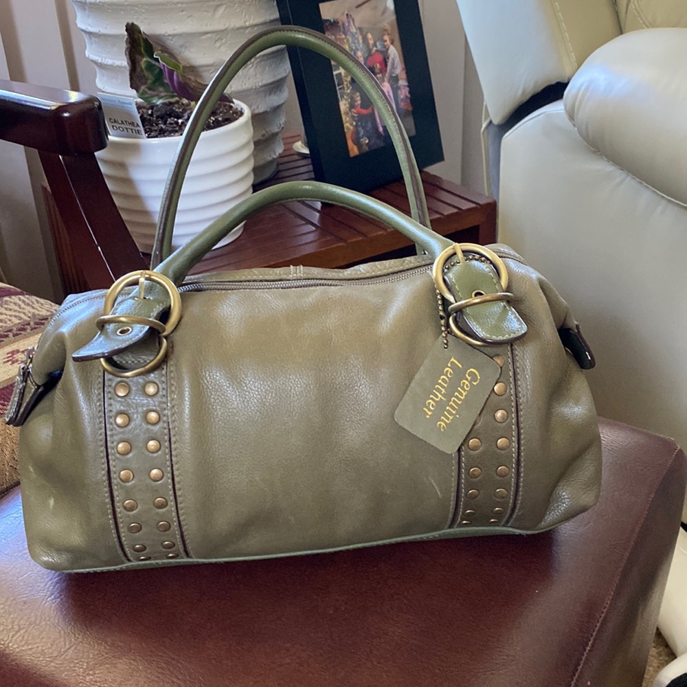Green purse. With gold studs. Slightly used